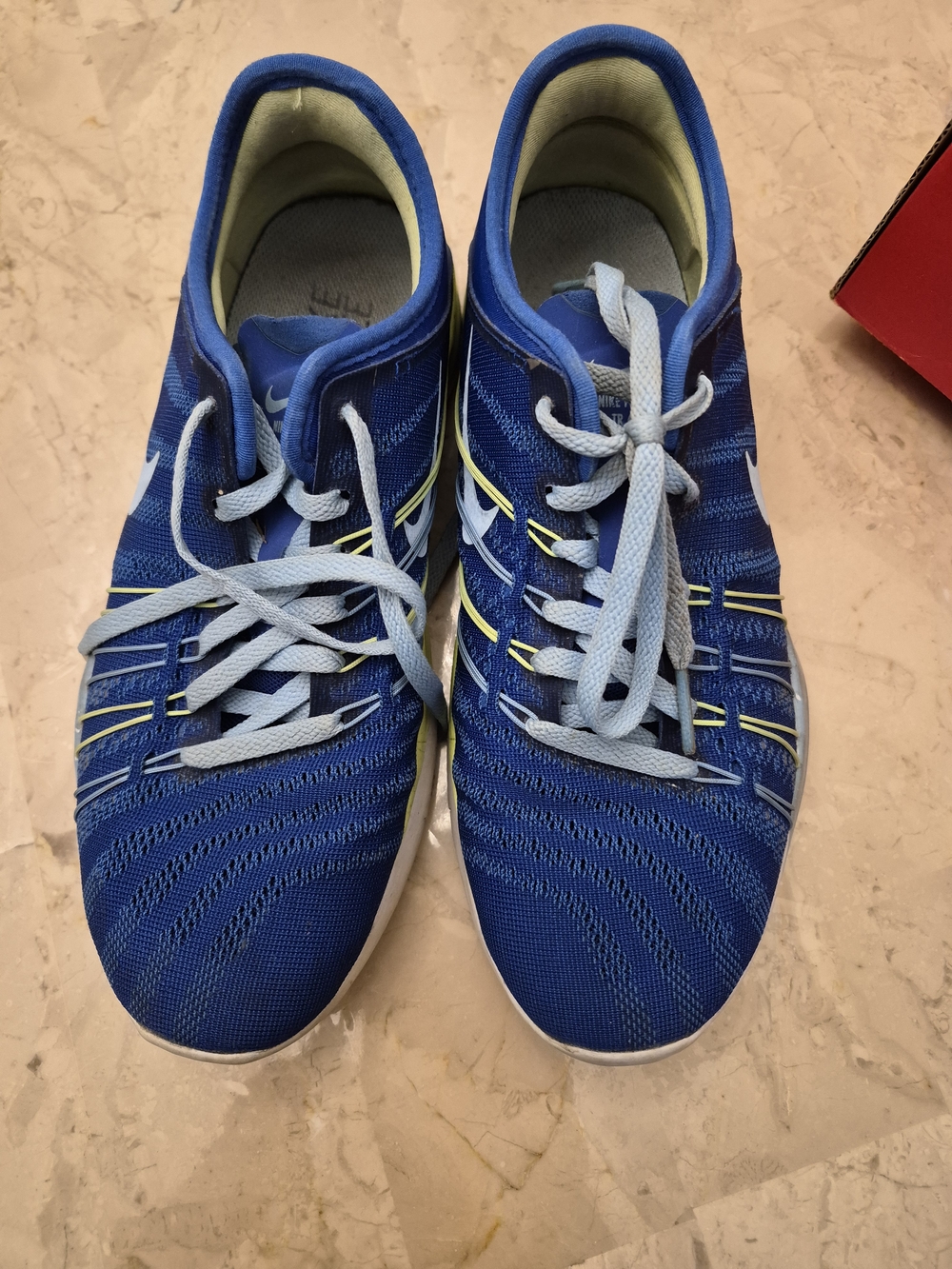 Nike Blue Women's Running Sneakers with Light Blue Laces and Yellow Trim